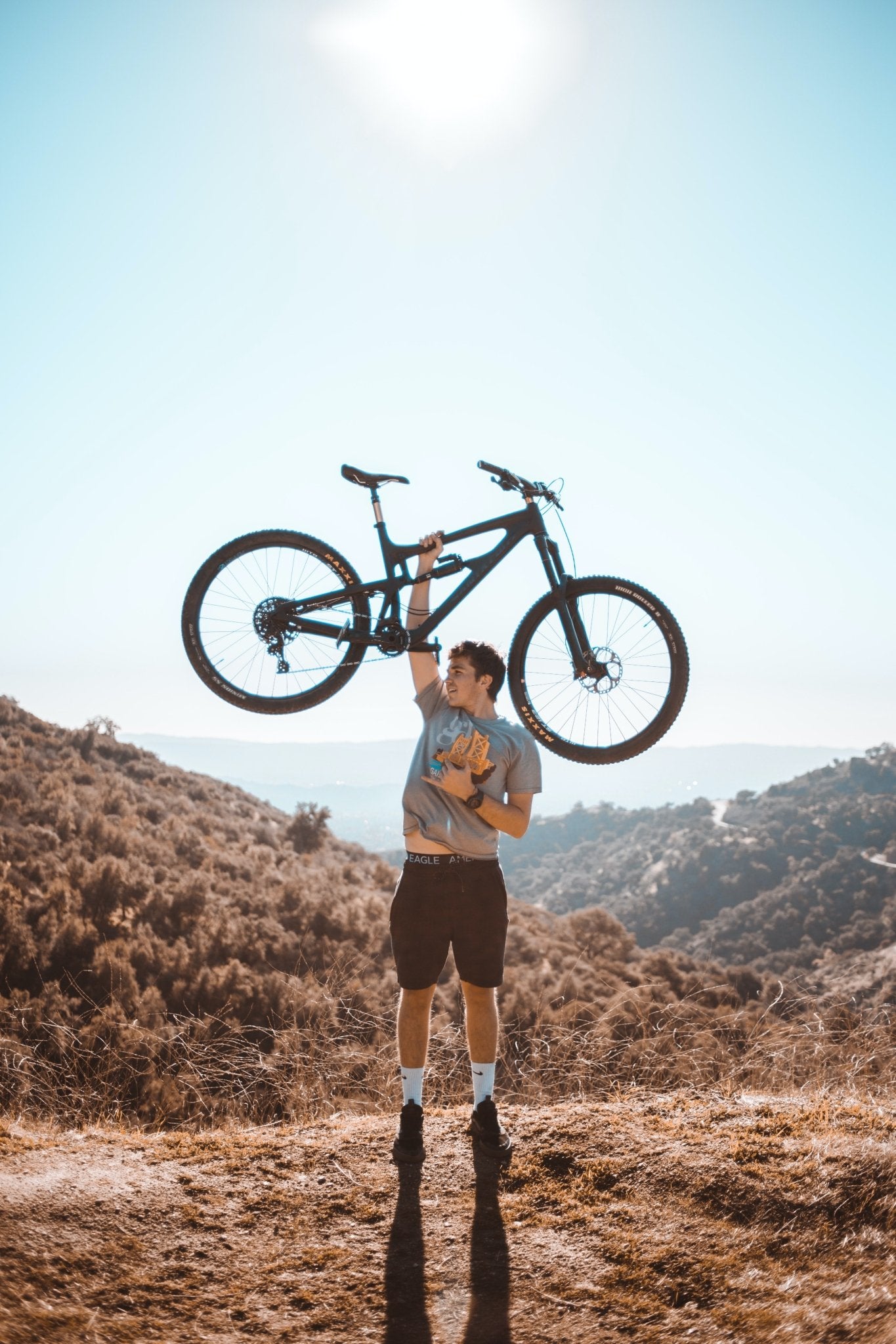 man holding a mountain bike