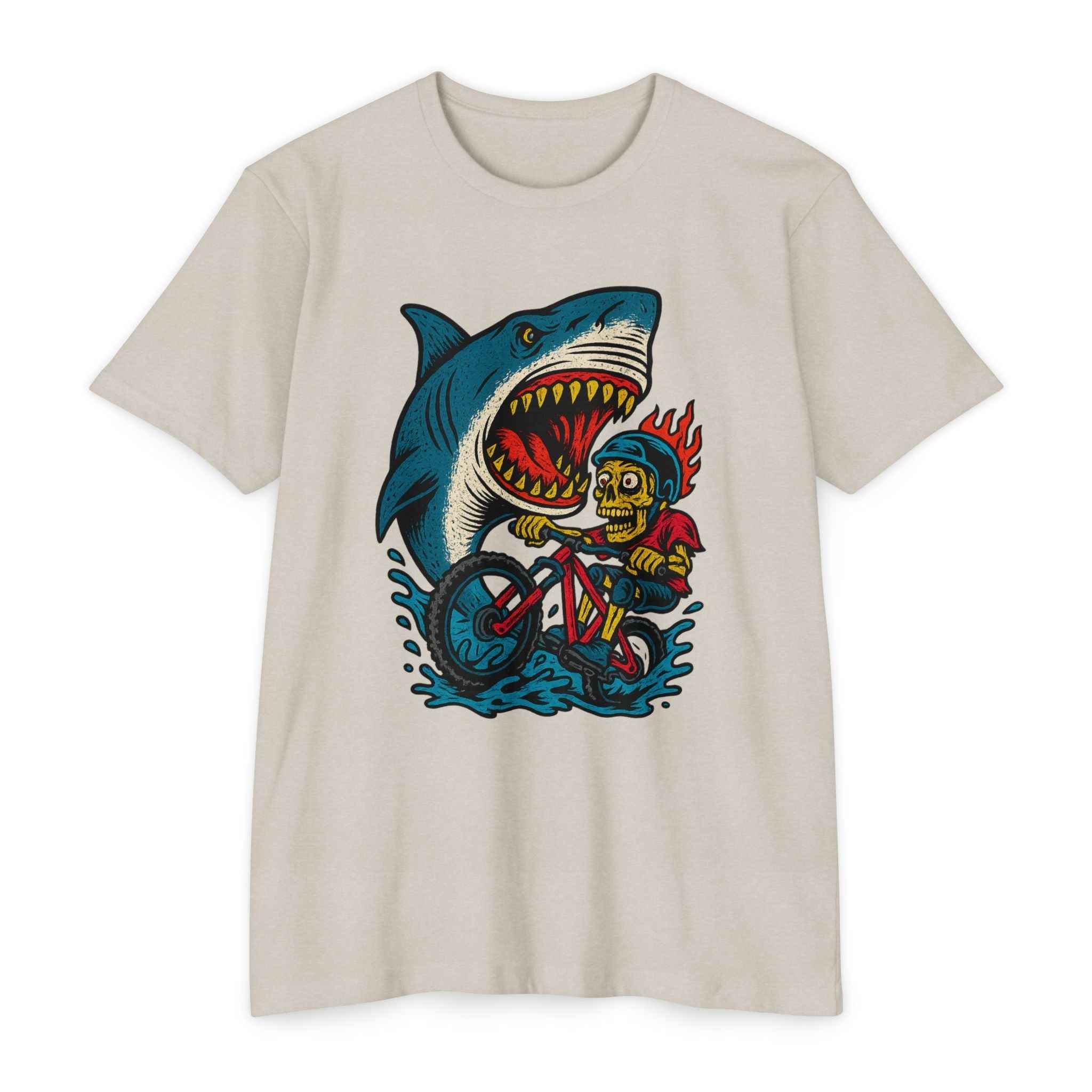 Beige Shark Attack MTB Tee with colorful skeleton biker and shark graphic. Unique men's CVC mountain bike shirt for casual or trail wear.