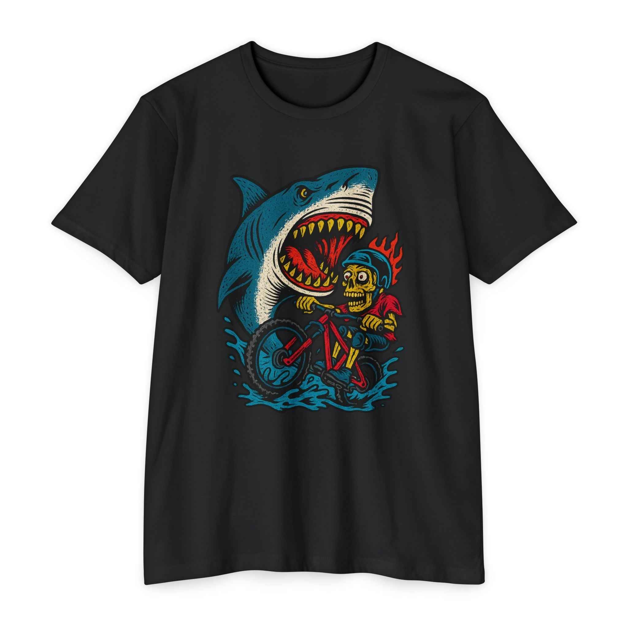 Shark Attack MTB Tee in black featuring a bold graphic of a skeleton biker escaping a shark. Ideal men's CVC mountain bike shirt for thrill-seekers.