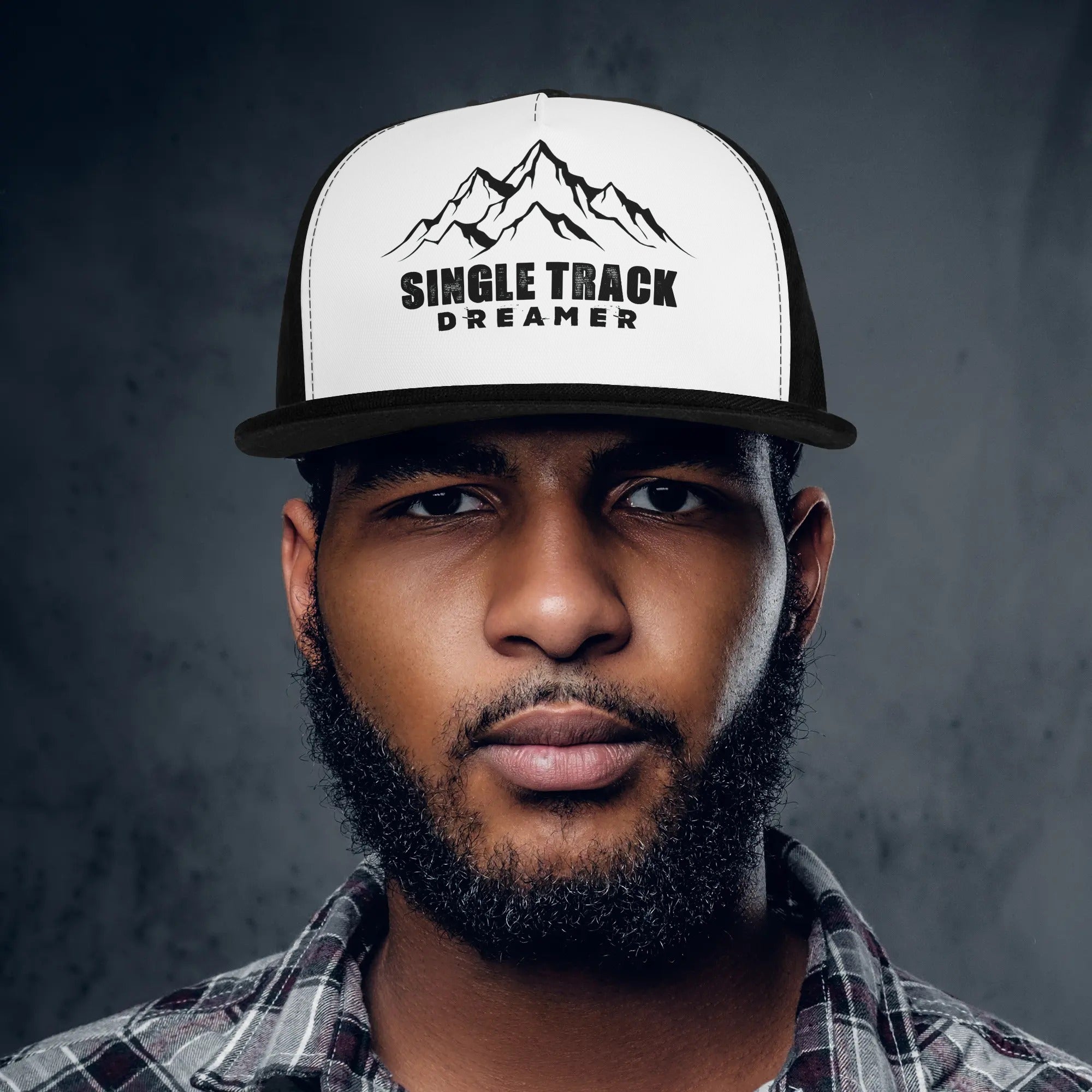 a man with a beard wearing a hat