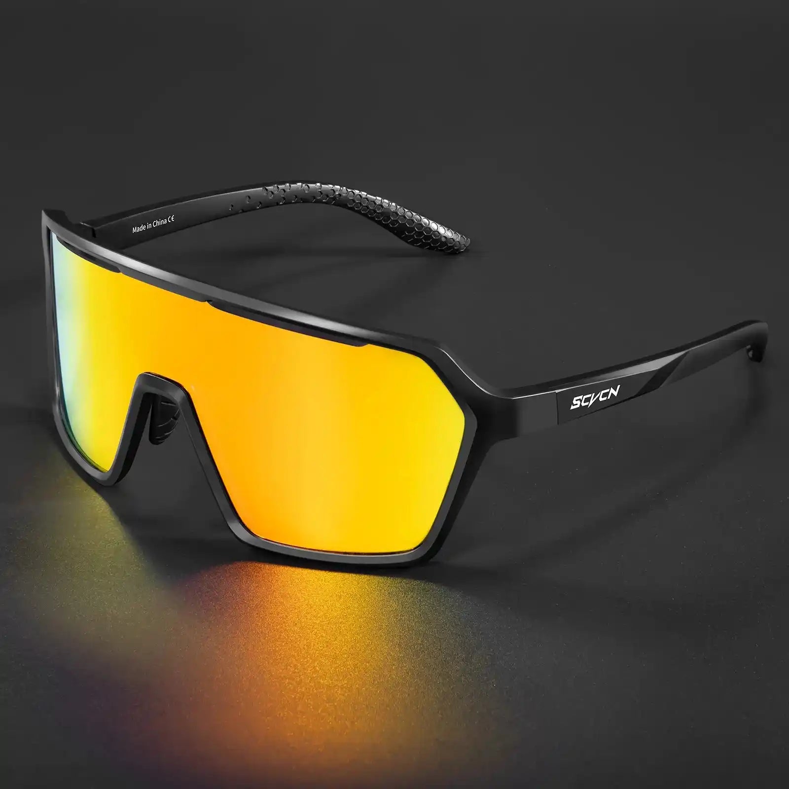 Black photochromic cycling sunglasses with orange mirrored UV400 lenses, designed for outdoor sports and sun protection.