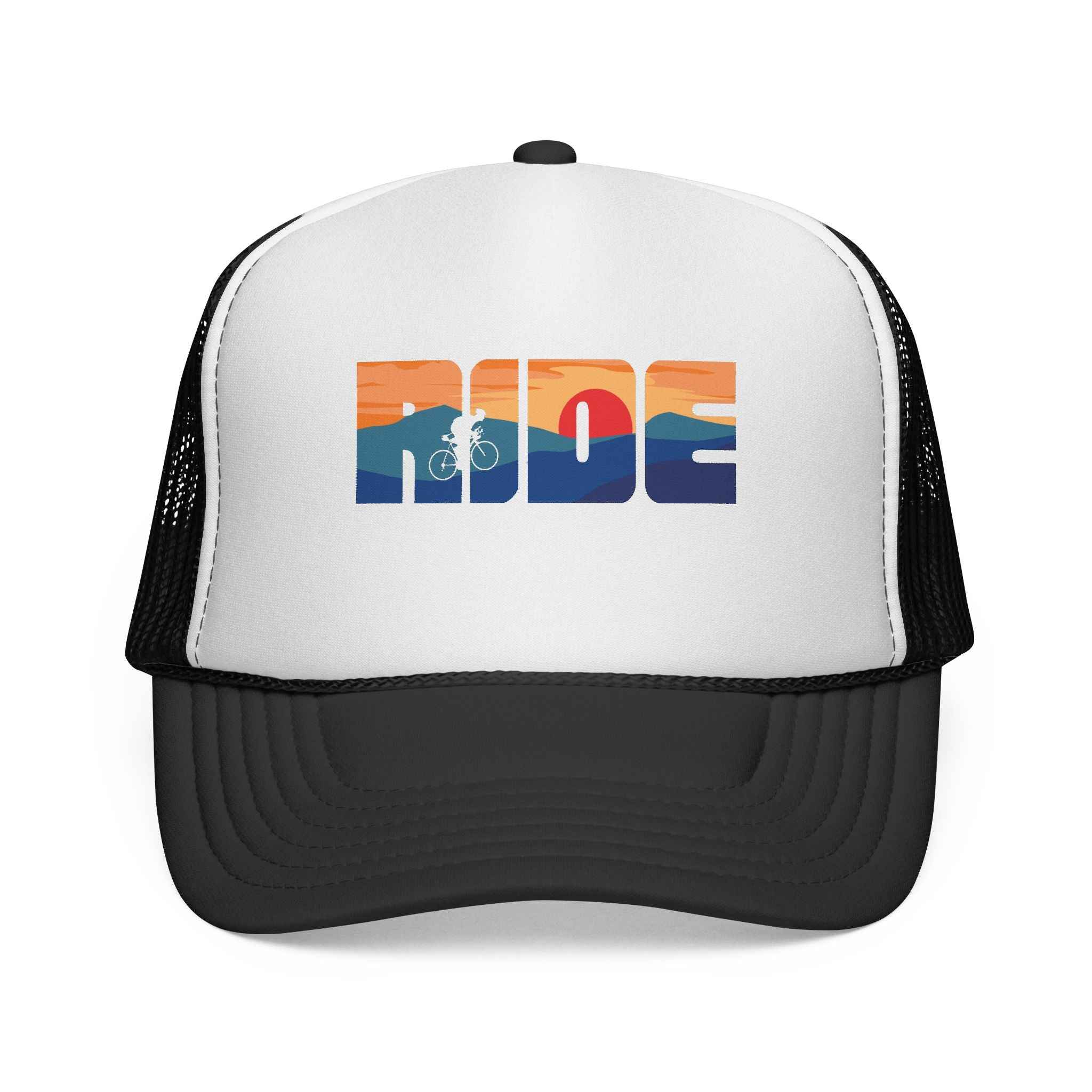 MTB “RIDE” Sunset Trucker Cap featuring a retro mountain bike logo with a sunset landscape design on a white front panel and black mesh back.