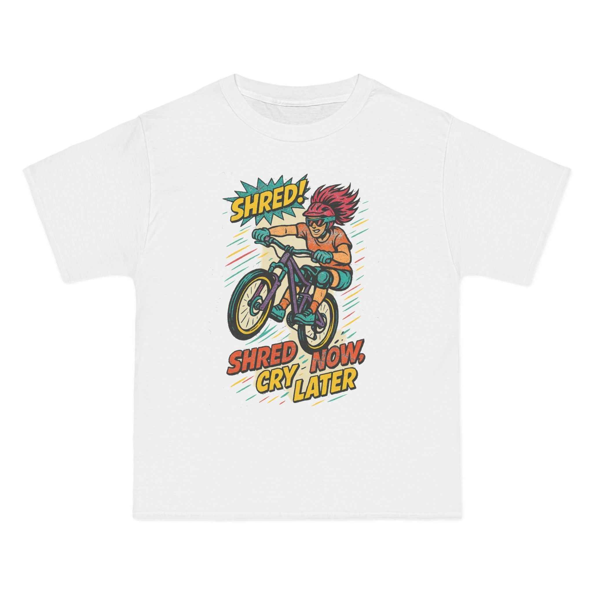 White Retro Biker Graphic Tee for adventure enthusiasts with comic-style cyclist and 'Shred Now, Cry Later' text, 100% cotton casual wear.