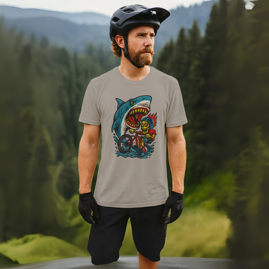 Man wearing a t-shirt with a shark graphic design in a forest setting
