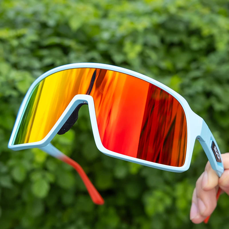 SCVCN cycling glasses with red-orange mirrored lenses and light blue frame, designed for stylish UV protection during biking and outdoor sports.