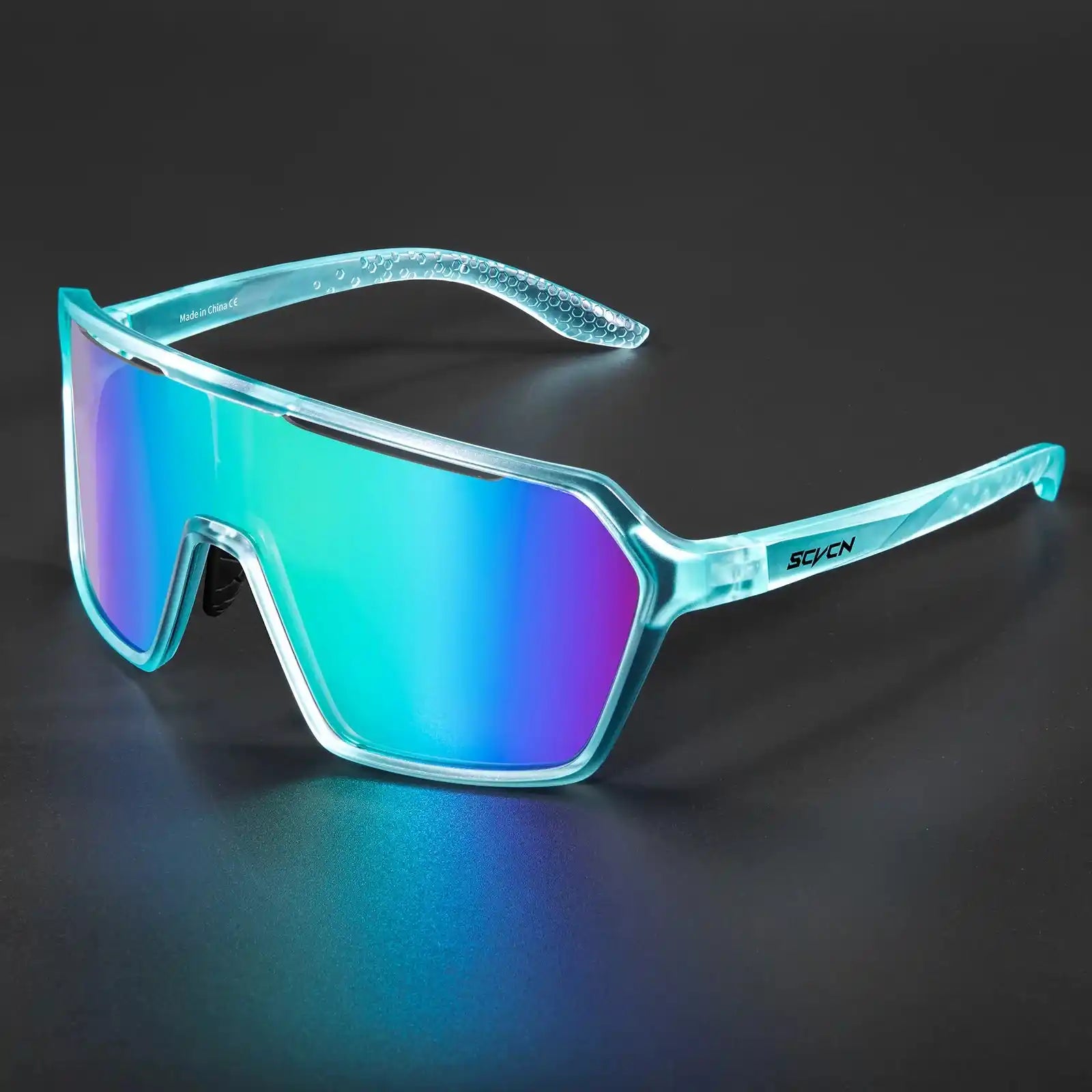 Photochromic cycling sunglasses with blue frame and UV400 mirrored lenses, ideal for outdoor sports and changing light conditions.