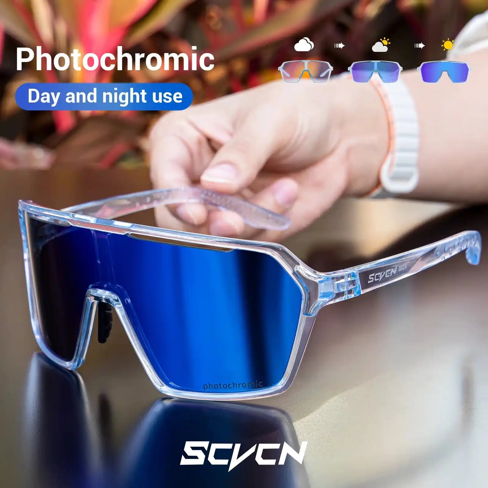 Photochromic cycling sunglasses with blue lenses, shown in hand with day-to-night use icons for outdoor sports versatility.