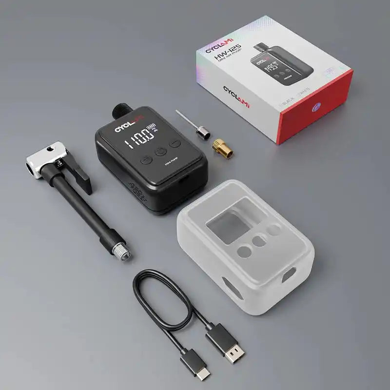 Complete electric tire pump kit with black pump, USB cable, adapters, and silicone sleeve. Designed for efficient and easy bike tire inflating.