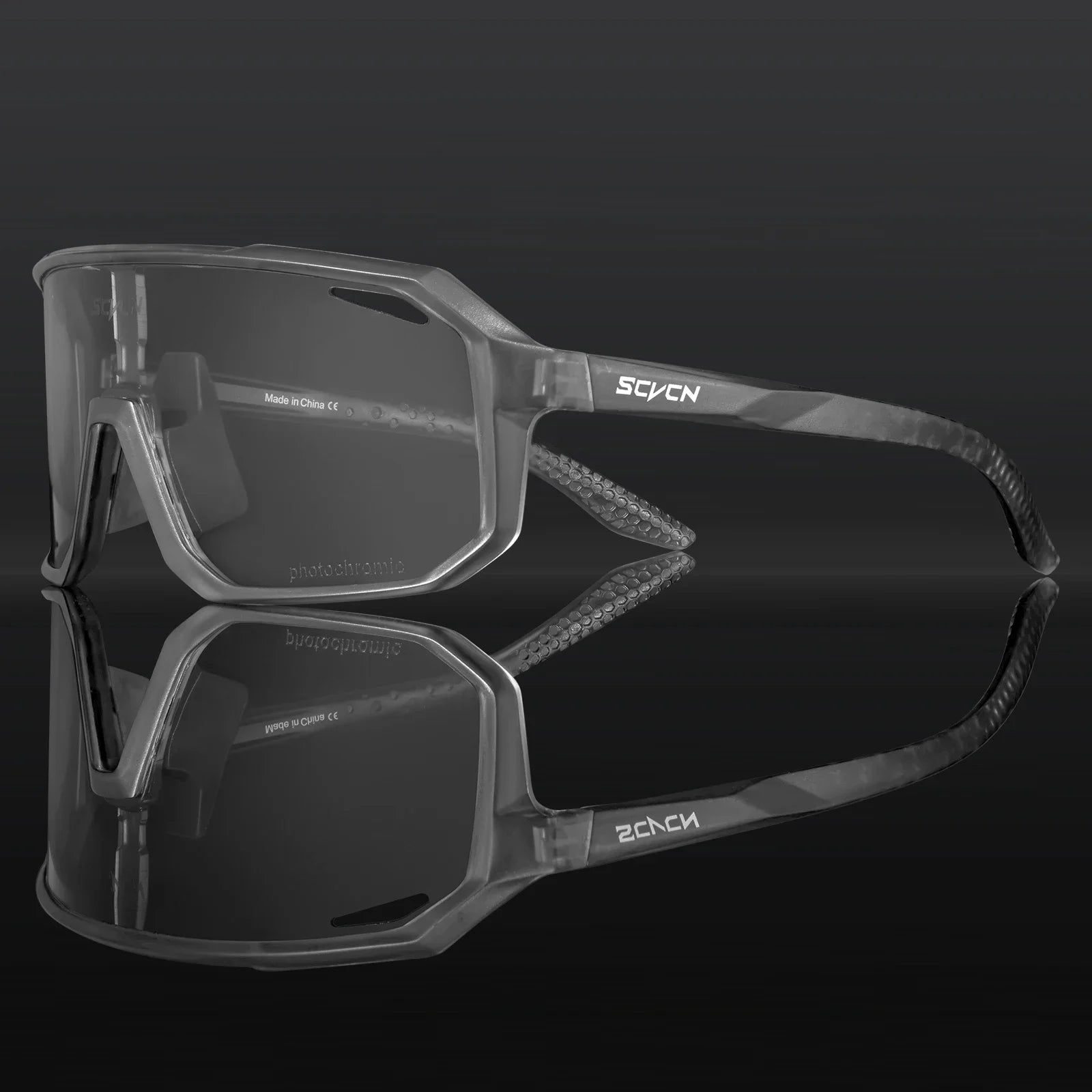 SCVCN photochromic cycling glasses with dark adaptive lens and matte grey frame, offering UV400 protection and impact resistance for outdoor sports.