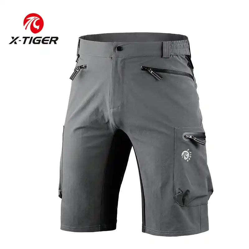 Gray X-TIGER waterproof MTB shorts with reflective logo and multiple zippered pockets for secure storage during cycling.