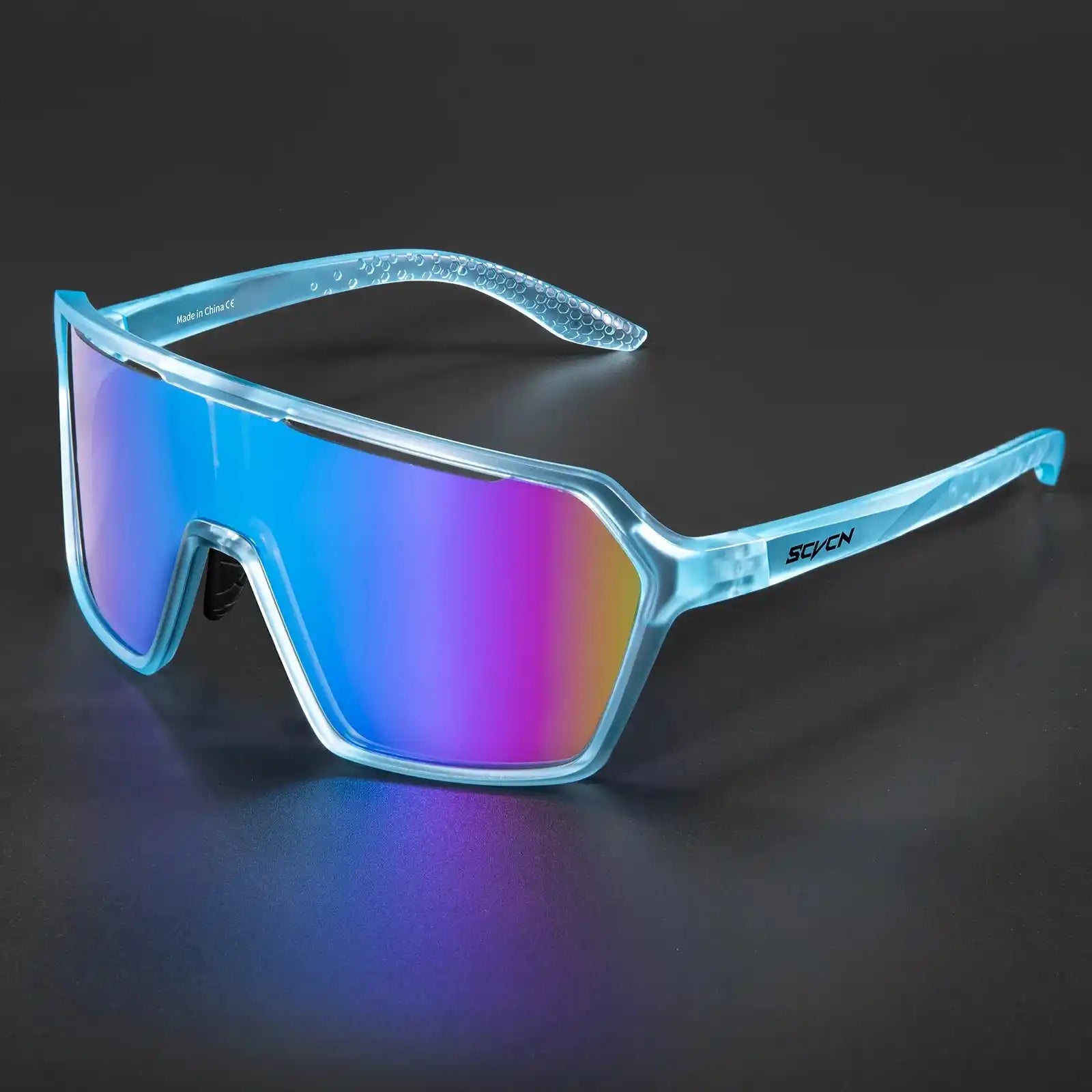Blue photochromic cycling sunglasses with mirrored UV400 lenses, offering lightweight protection for outdoor sports.