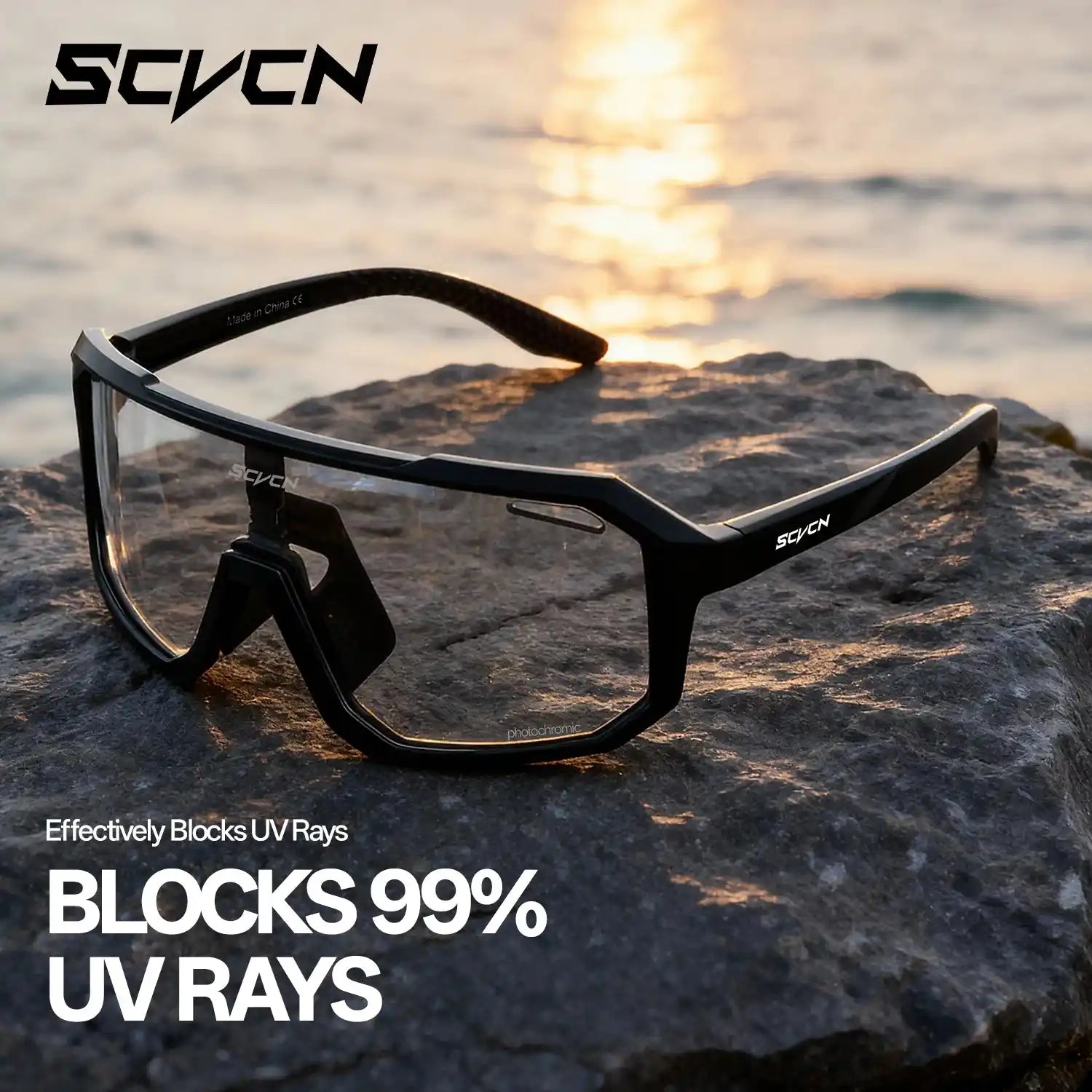 SCVCN HOT MTB cycling glasses with black frame and clear lenses on a rock, highlighting 99% UV ray blocking for outdoor sports use.